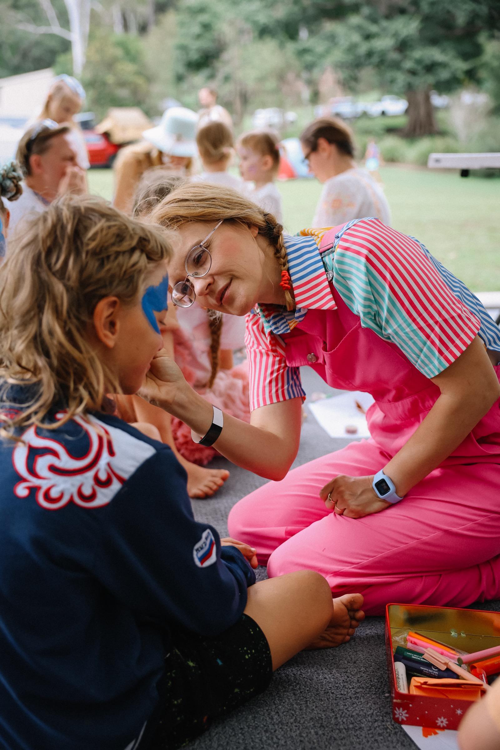 Child getting face painted
